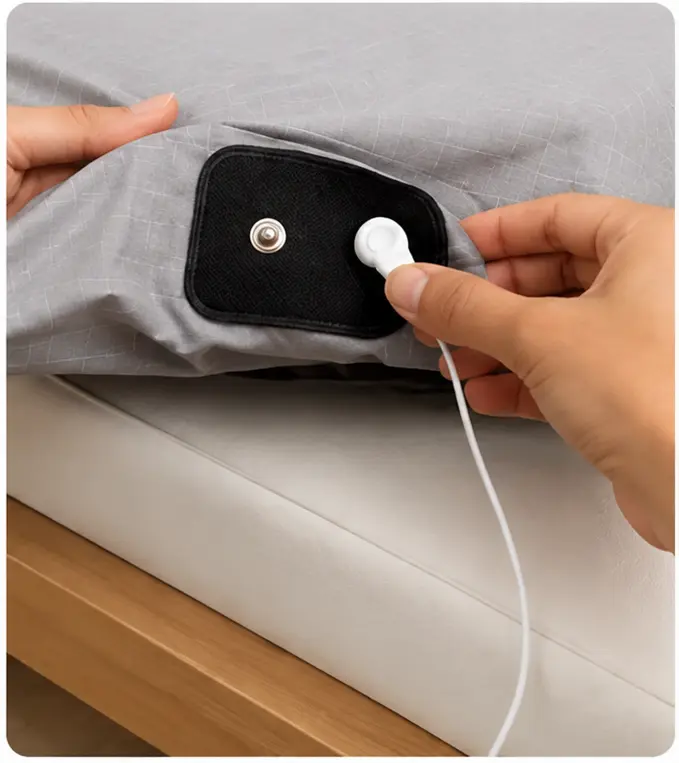 Plugging the grounding cord into a grounded outlet